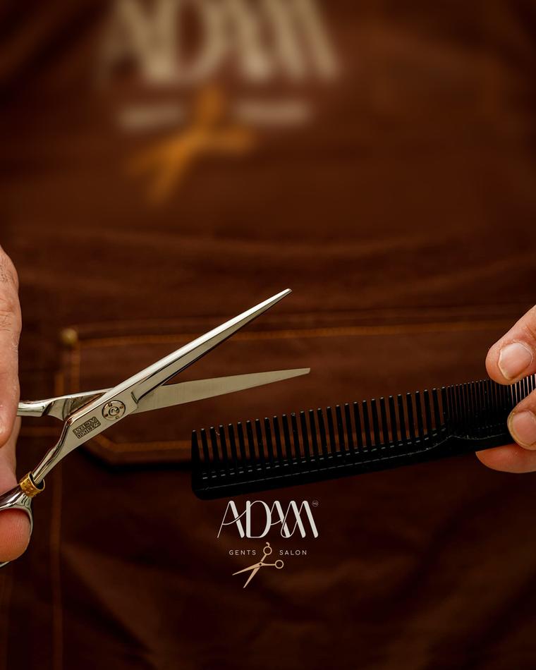 Scissors and comb on an Adam NQ cape